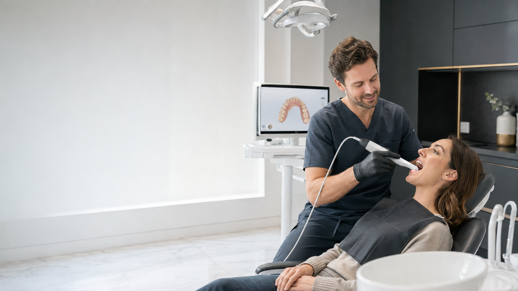Dentist using an intraoral scanner in a bright modern operatory